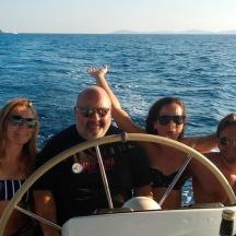 a group of people on a boat in the water