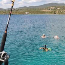 a group of people swimming in a lake