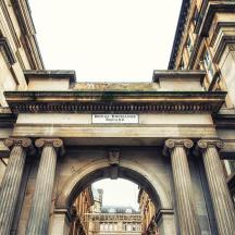 an archway in a building with a sign on it