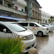 a group of cars parked in a parking lot