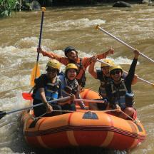a group of people in a raft on a river