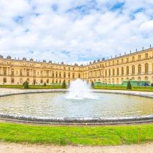 a fountain in front of a large building