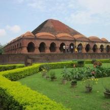a building with a garden in front of it