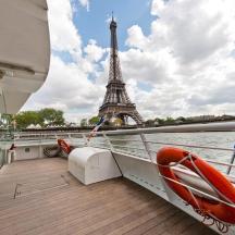 a boat in front of the eiffel tower