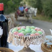 a bottle of wine and a bowl of eggs on a table