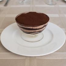 a chocolate dessert on a plate on a table