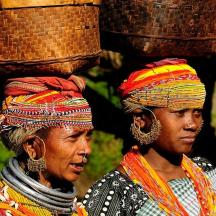 two women wearing baskets on top of their heads
