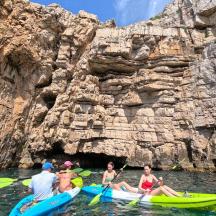 a group of people in kayaks in the water