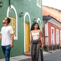 a man and a woman walking down a street