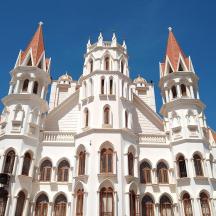 a large white building with towers on top of it
