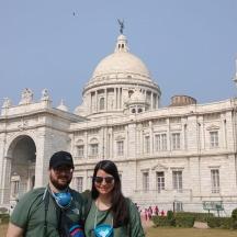 a man and a woman standing in front of a building