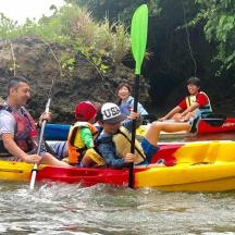 a group of people on a raft in the water