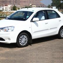 a white car parked in a parking lot