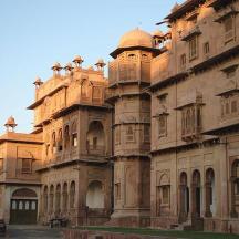 a large stone building with domes on top of it