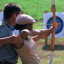 a man and a woman holding a bow and arrow
