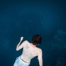 a man standing in the water in the ocean