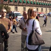 a group of people standing on a city street