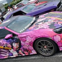 a pink car with a painting on the side