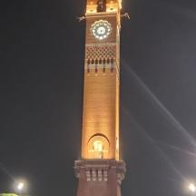 a large clock tower with a clock on it at night