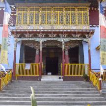 an entrance to a building with stairs in front
