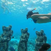 a group of people swimming in the ocean