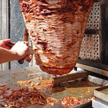 a person is pulling food out of a machine