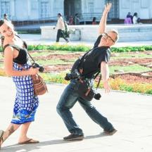 a man and a woman walking down a sidewalk