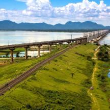a long bridge over a river with a road