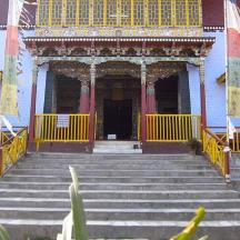 a building with stairs leading up to a doorway