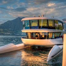 a large boat sitting in the water on a lake