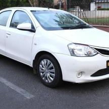 a white car parked in a parking lot