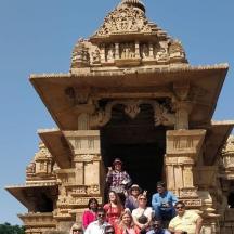 a group of people standing in front of a temple