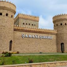 a building with two towers with a sign on it