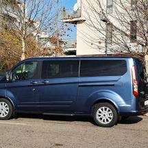 a blue van parked in a parking lot