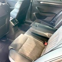 an open back seat of a car with the back seatsktop