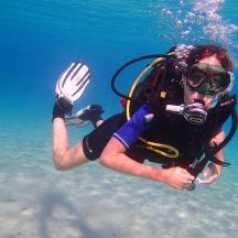 a person in the water wearing a diver gear