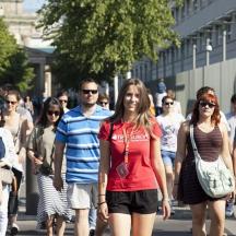 a group of people walking down a street