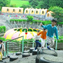 a group of children playing in a water park