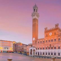 a clock tower in the middle of a city