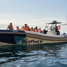 a group of people on a boat in the water