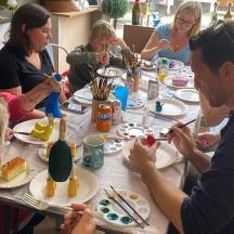 a group of people sitting around a table eating food