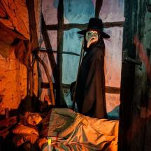 a painting of a man wearing a plague doctor