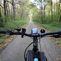 a person riding a bike on a dirt road