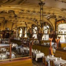 a restaurant with tables and chairs in a building
