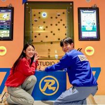 a man and a woman playing a video game