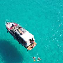a boat in the water with two people on it