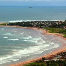 an aerial view of a beach with waves