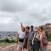a group of people standing on top of a mountain