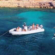 a group of people on a boat in the water