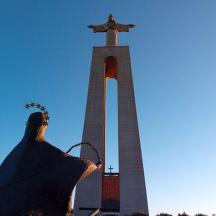 a tall monument with a cross on top of it
